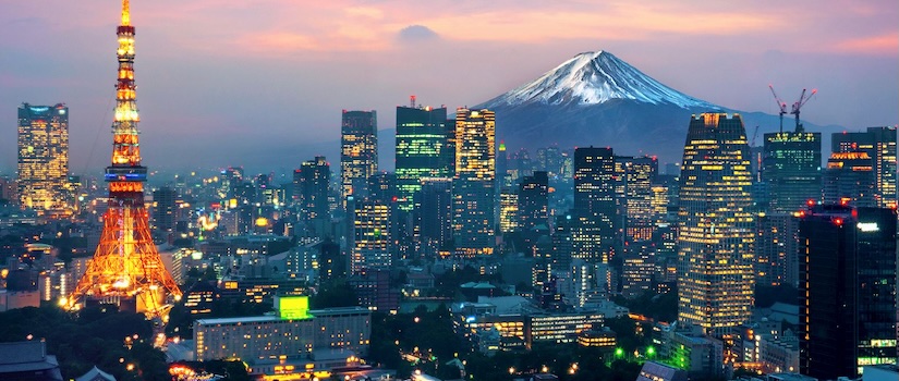 A view of the Tokyo skyline with a mountain in the background