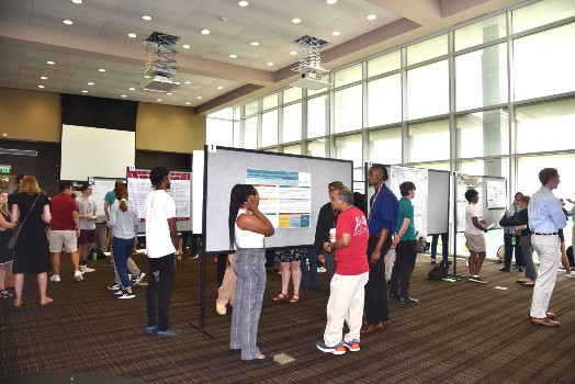undergrads presenting their research at the summer research symposium