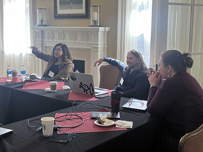 women discussing book at panel