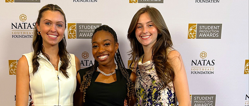 Three female students with awards