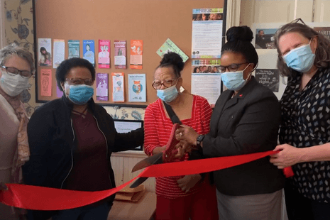 CFEC Director and CFRC staff cutting red ribbon on opening day