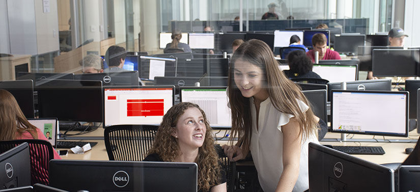 Master of Science in Quantitative Economics students working in the trading room.