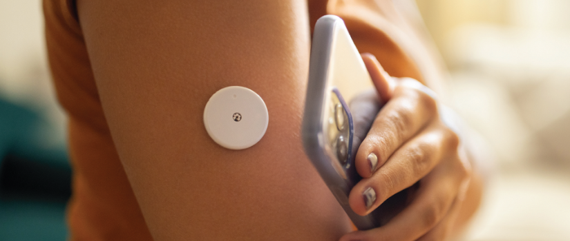 Arm with medical device and hand holding phone
