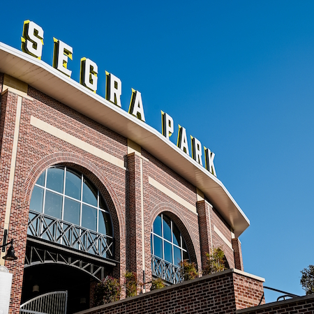 Exterior view of Segra basepale park sign against a blue sky