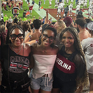 Sierra Brent, center, with friends at football game